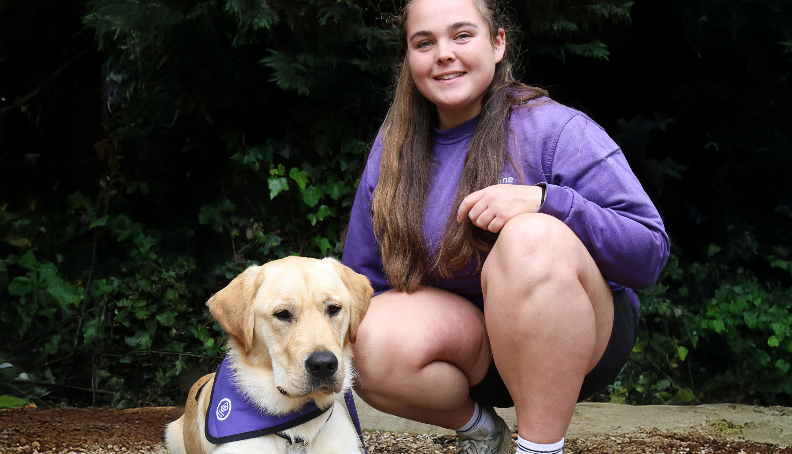 A photo of our Puppy Training Volunteer Charleigh and puppy in training Winstone